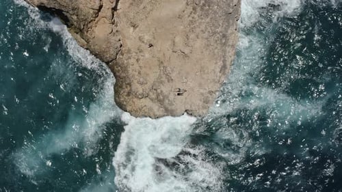 Summer in Lombok Island, Ocean Waves Against Cliff and Travelers Laying