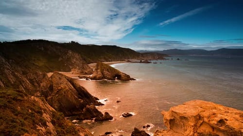 Picturesque Coastline with Rocky Cliffs and Sandy Beach