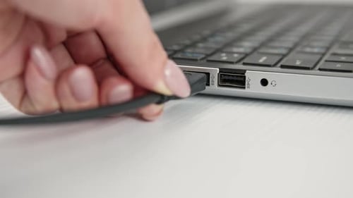 Connect Usb Flash Drive Key to Port of Laptop Pc Computer on Light Background Closeup