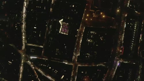 AERIAL: Slow Overhead Shot of City at Night with Lights and Traffic, Cologne, Germany