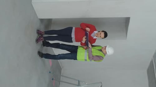 Client and Contractor Discuss Renovation Work