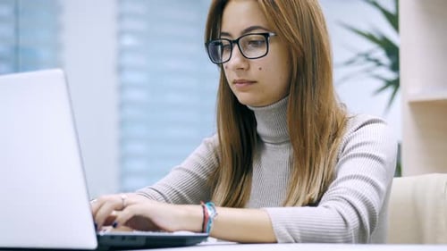 Beautiful Woman, Office Worker Using Laptop at Office. Female Freelance, Manager