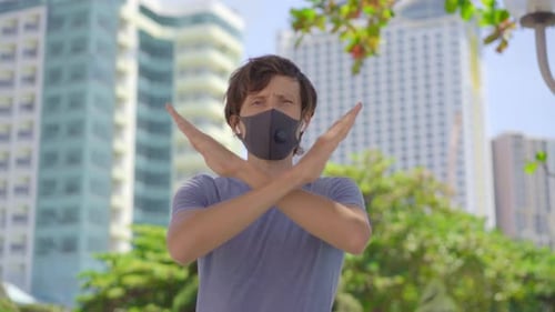 Young Adult Man Gesturing "No" Outdoors