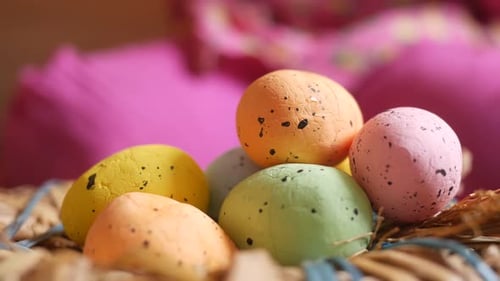 Child Takes Colorful Easter Eggs from Woven Nest