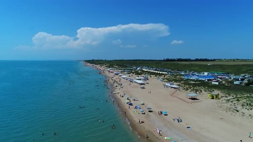 Sandy Beach of the Black Sea Tourists on the Shore Aerial View