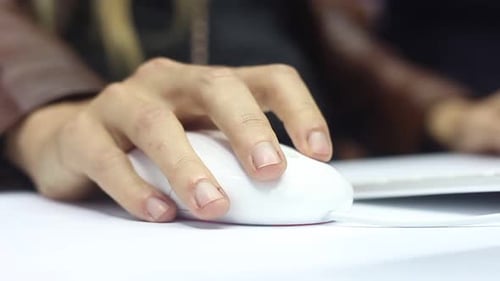 Hand Using Computer Mouse in Workplace Close Up
