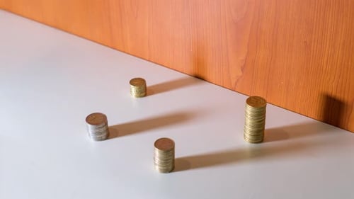 Coins Piling Up on a Table