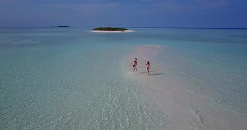 Beautiful couple on romantic honeymoon spend quality time on beach on summer white sandy 4K background