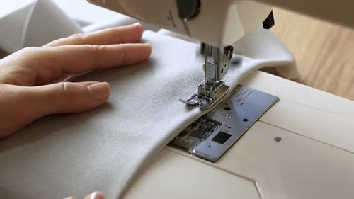 Sewing Machine Stitching Light Grey Fabric Close Up