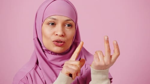 Woman with Hijab Counting and Thinking Close Up