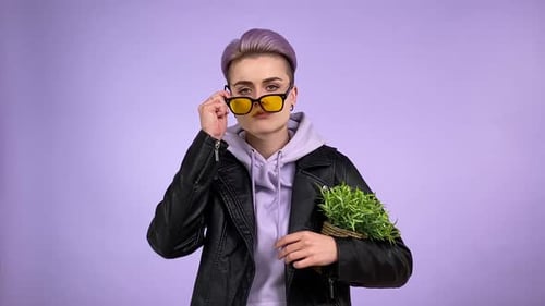 Cool Lesbian Giving Cynical Look Putting on Sunglasses Isolated