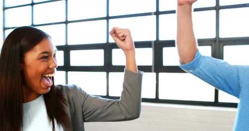 Team Celebration With High Fives in the Office