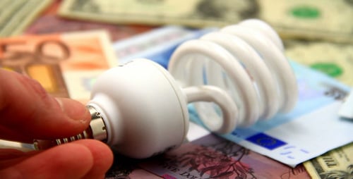 Close Up of Light Bulb on World Currency