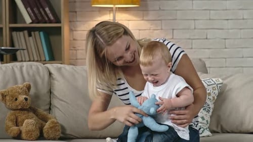Blond Woman Playing with Toddler