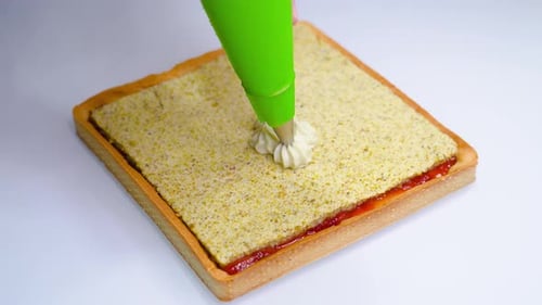 Cream is Put on Top of the Pie Tart