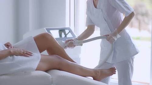 Woman Receives Leg Laser Hair Removal Treatment