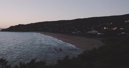 Ocean hitting the shore in a dusk light