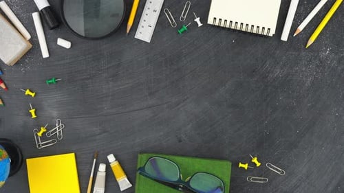 Education background with colorful stationery on blackboard top view border design with copy space