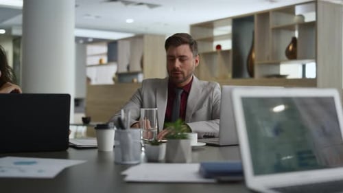 Executive Man Talking Presentation on Diverse Business Conference in Office