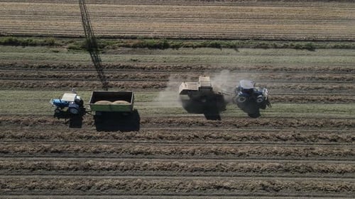 Tractor Continues to Harvest