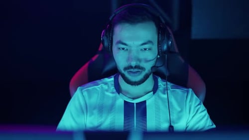 Young Adult Gamer Wearing Headset