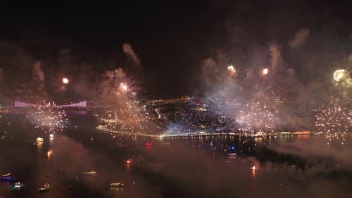 Spectacular Fireworks Exploding Above City at Night
