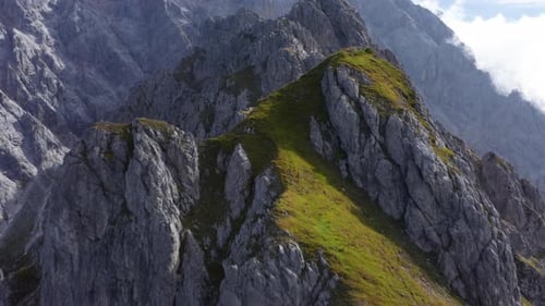 Majestic Drone Shot of the Rocky Mountaintops Reaching the Skies in Austria