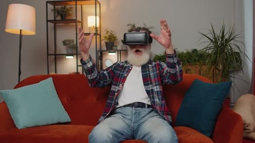 Senior Man Exploring Virtual Reality at Home