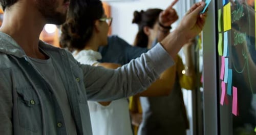 Collaborative Team Brainstorming Ideas at Modern Workplace