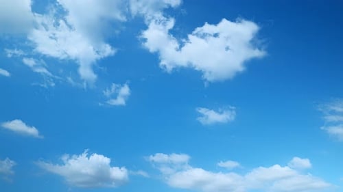 Fluffy White Clouds in a Bright Blue Sky