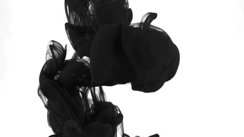 Black Ink Slowly Swirling Through Clear Liquid