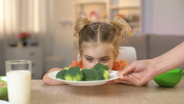 Female Kid Refusing to Eat Broccoli, Throwing Vegetable Away, Vitamin ...