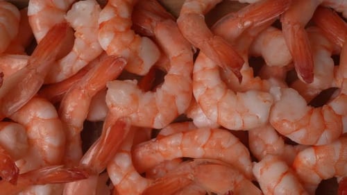 Close Up of Cooked Shrimp on Wooden Surface
