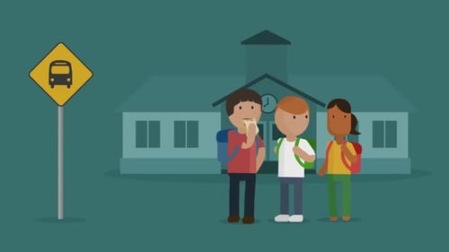 Children are waiting at the bus stop in front of the elementary school building.