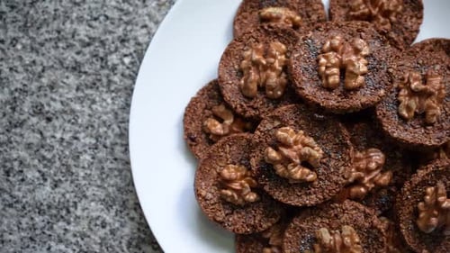 Chocolate Walnut Cookies Arranged on White Plate