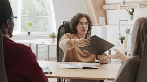 Business Meeting and Handshake in Bright Office