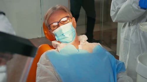 Adult Receives Dental Treatment in Modern Clinic