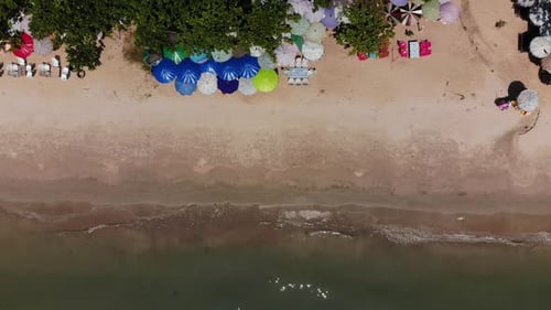 aerial view from drone shot of the beautiful beach and small wave with blue sea in summer