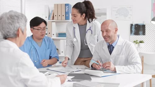 Medical Professionals Collaborating in a Bright Office