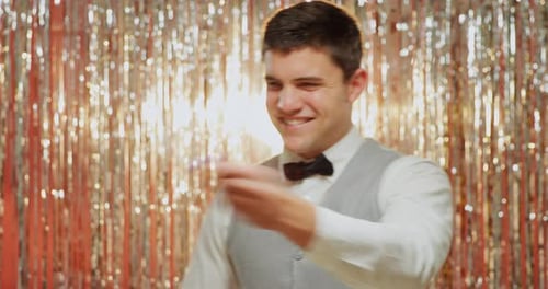 Young Man Blowing Bubbles at Party Celebration