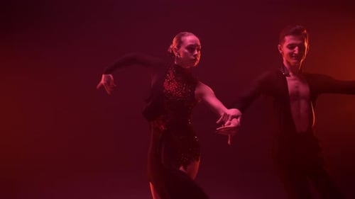 Graceful Couple Performing Latin Dance Indoors