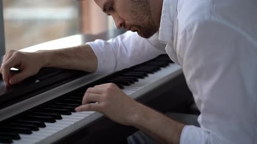 Man Plays Piano Keyboard, Close-Up