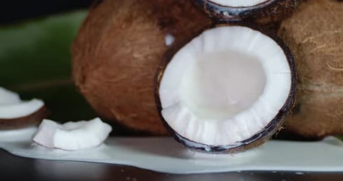 Broken Coconut with Coconut Milk. Rotates Slowly