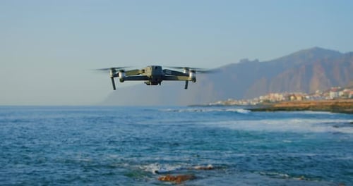 Drone Flying over Ocean near Coastline