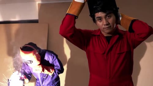 Portrait of young industrial technician in the factory.