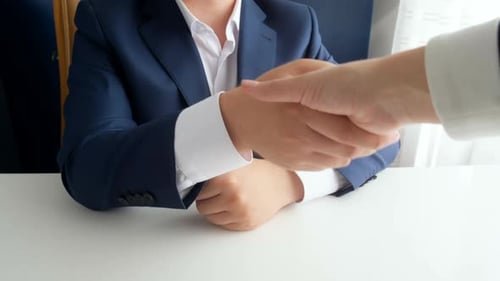 Closeup Footage of Corrupted Official Shaking Hands with Businesswoman and Receiving Bribe