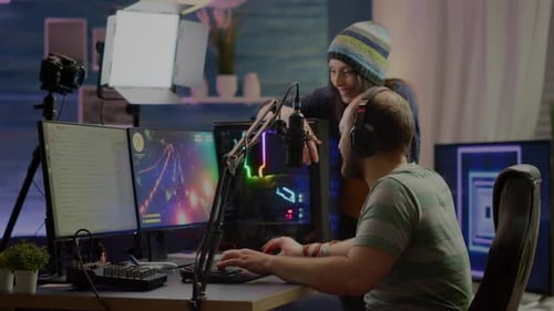 Gamer and Assistant in Streaming Studio