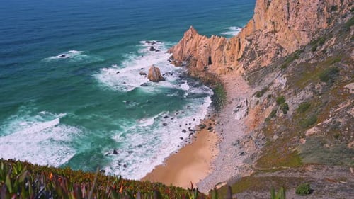 Rugged Coastline Near Praia Do Ursa Beach with Beautiful Orange Colored Cliffs at Atlantic Ocean
