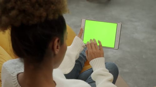 Woman Uses Tablet with Green Screen at Home