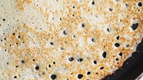 Pancakes Cooking in a Pan, Stack on Plate